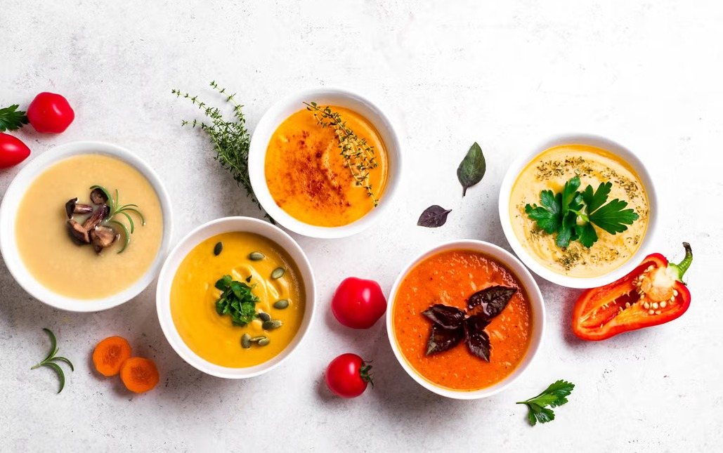Bowls of vegetable soup made with frozen vegetables and herbs