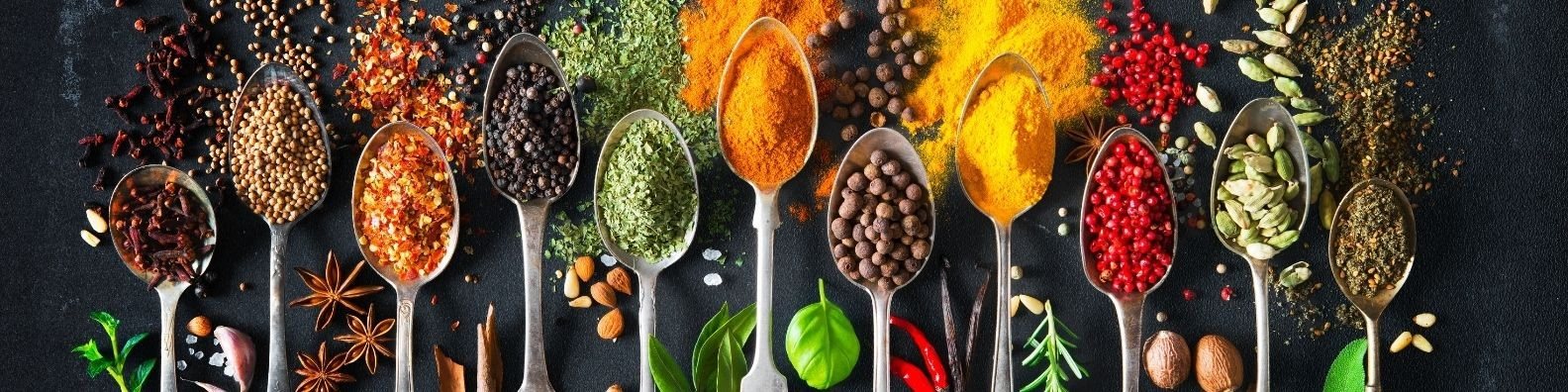 Spoons of whole and ground spices