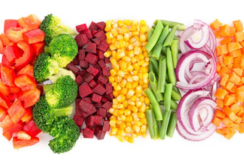 Rows of IQF diced red pepper, broccoli, beet, sweet corn, green beans, red onion and carrot